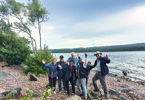 Aleman with cruise passengers during an Invergordon shore tour