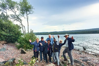 Aleman with a family group beside Loch Ness on a custom private tour